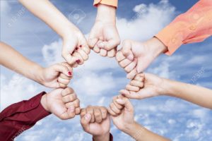 18985286-Close-up-of-hands-gesturing-unity-under-blue-sky-Stock-Photo-unity-strength